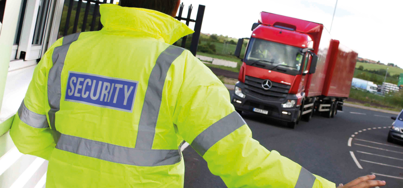 Security guard guiding a truck through main gates | Constant Security Services