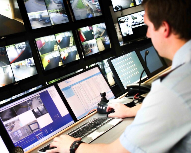 Man monitoring security screens | Security Services | Constant Security Services