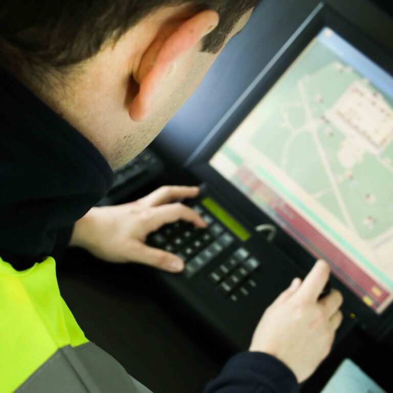 Man checking computer | Mobile security | Constant Security Services
